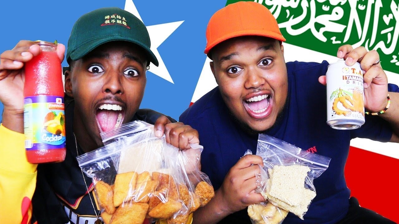 Chunkz and friend holding up food
