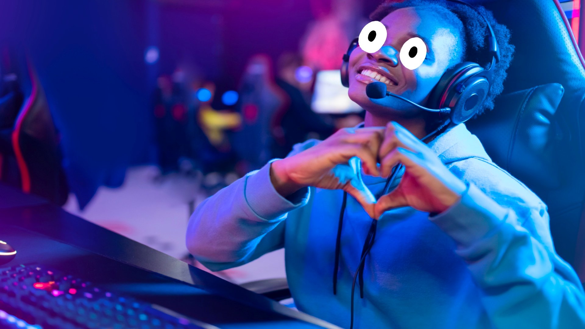 A gamer making a heart shape with their hands