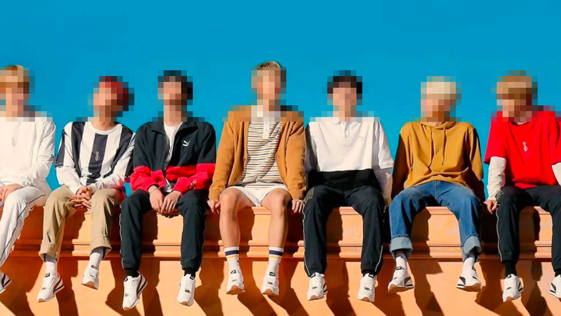 A blurred image of a K-pop group