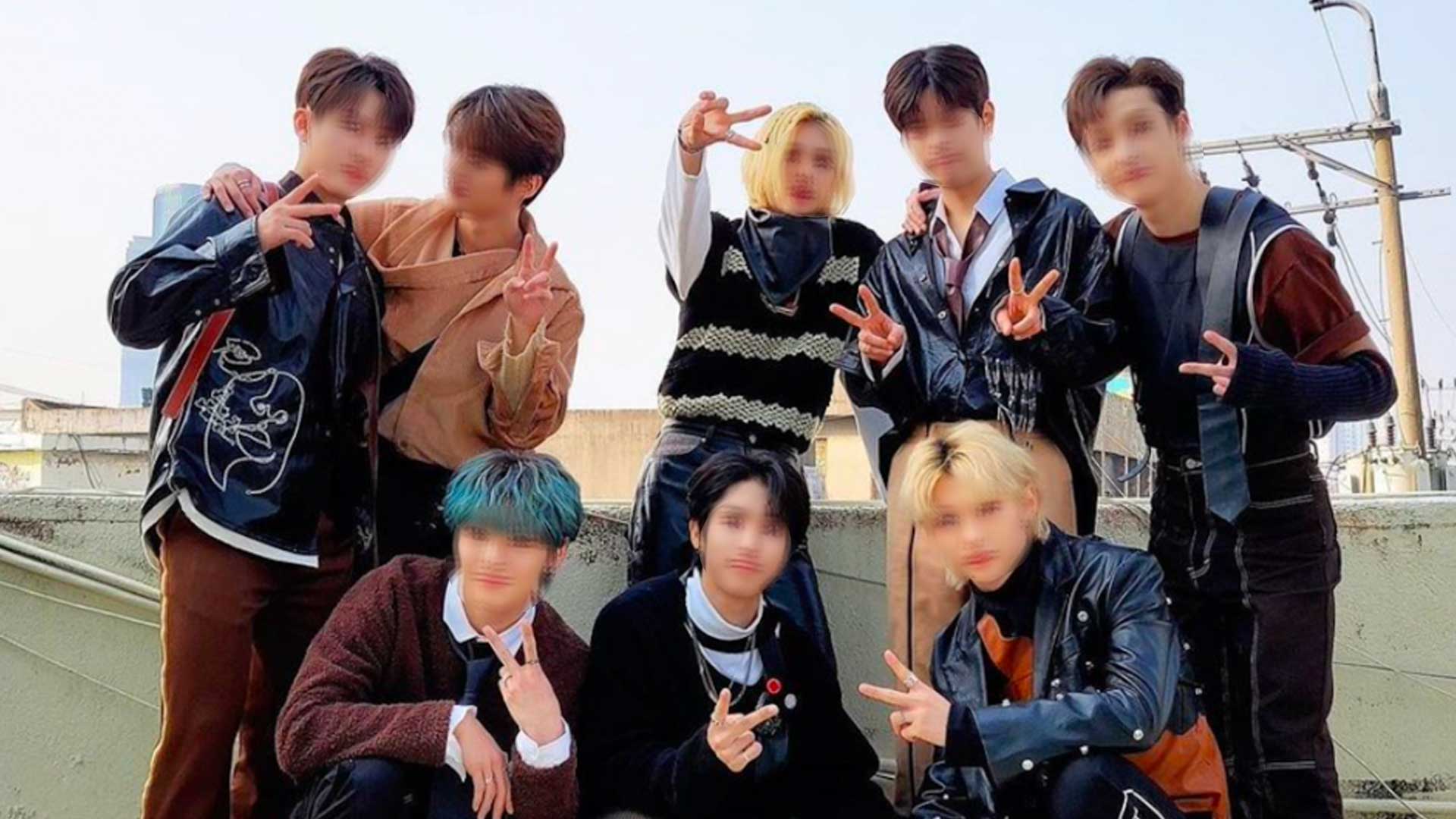 A blurred image of a K-Pop group