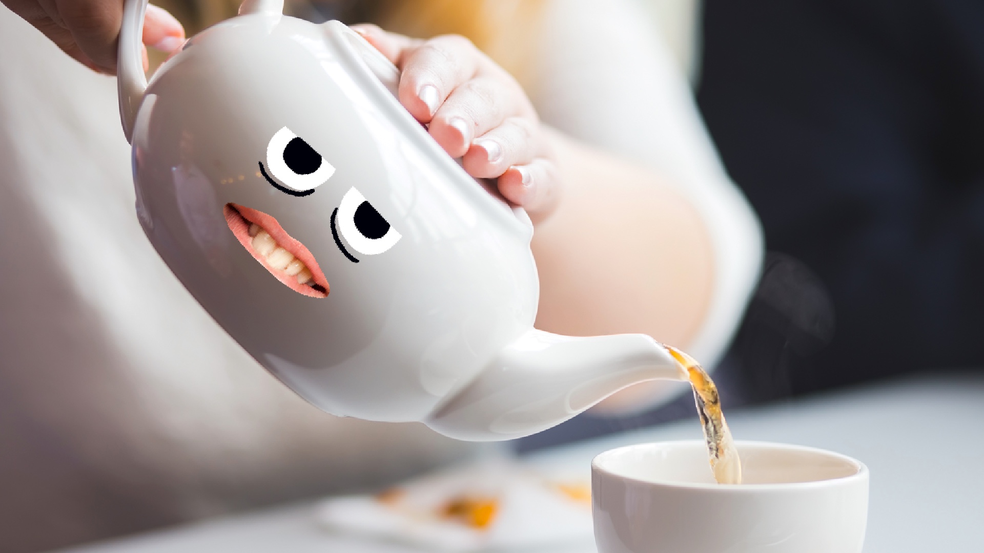 A tea pot pouring a cup of tea