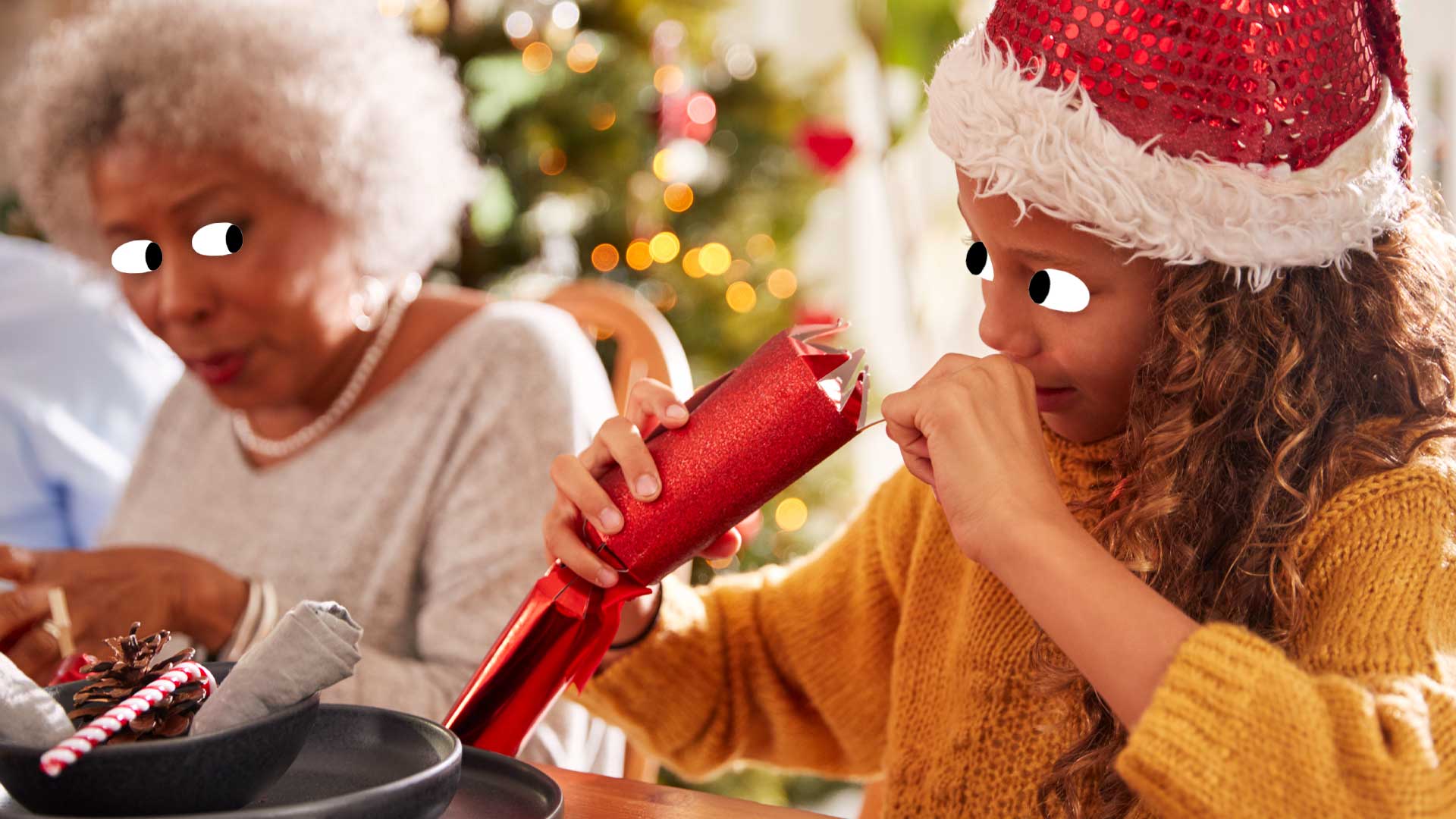 A girl peeking in a Christmas cracker