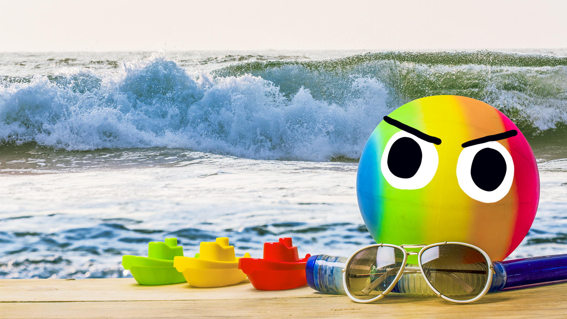 A beach ball and accessories on the beach