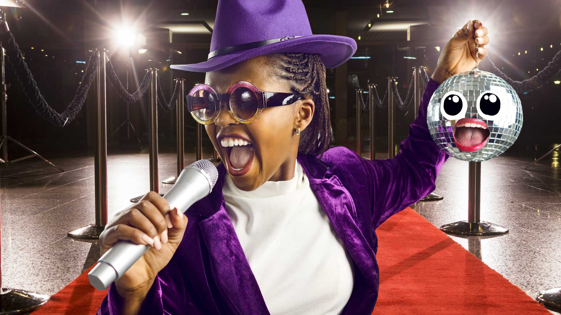 A woman in a purple outfit singing on the red carpet 