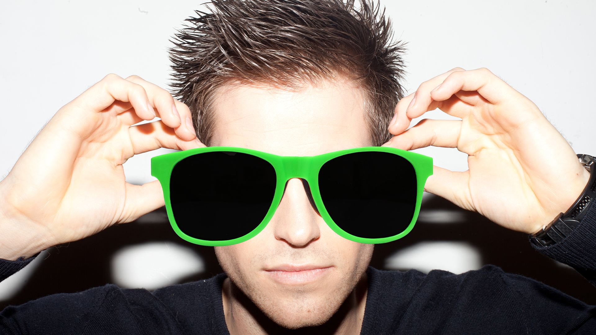 Guy in sunglasses with big spiky hair