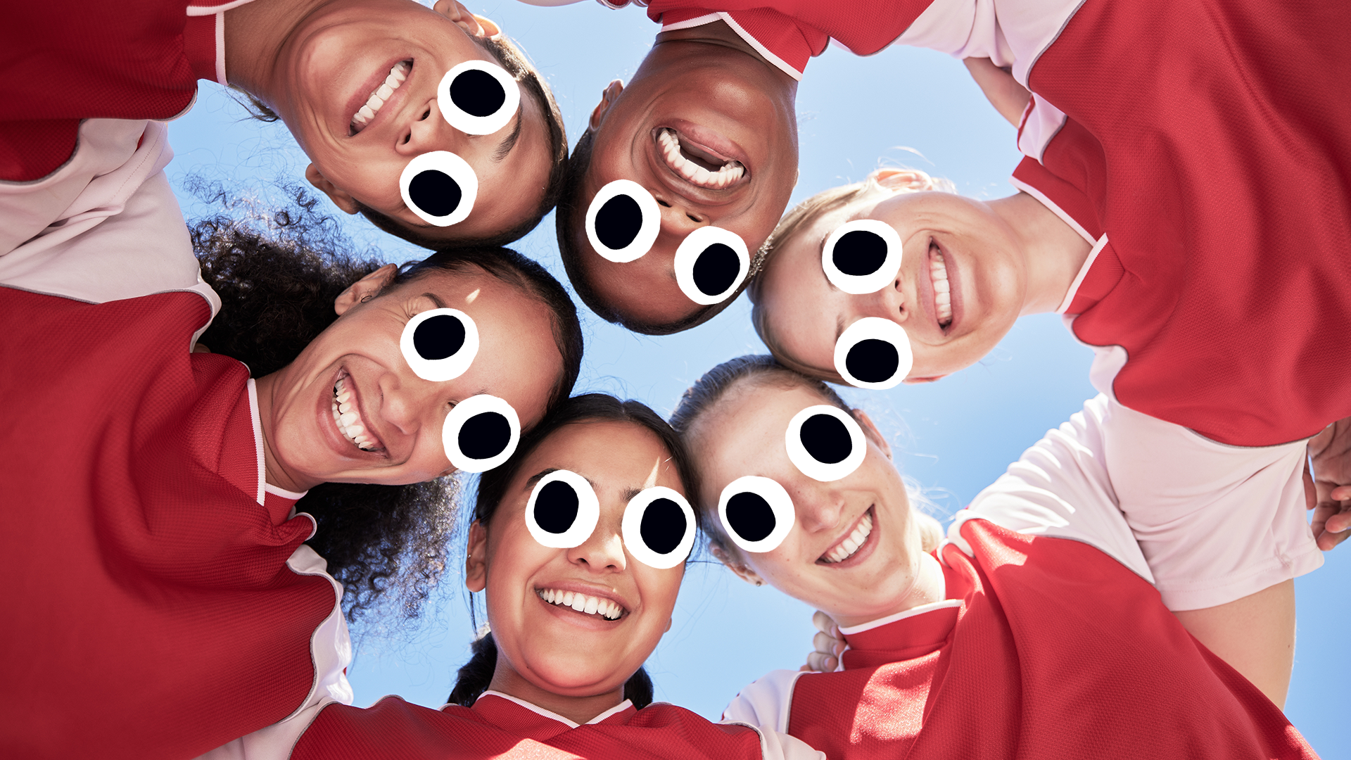Female football team with heads together