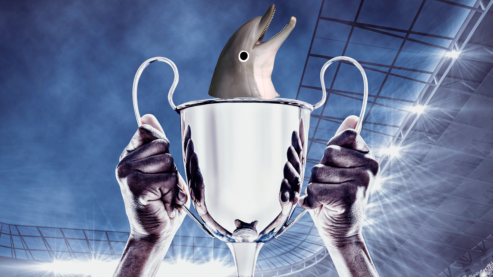 Someone holding trophy that Beano dolphin peeps out of