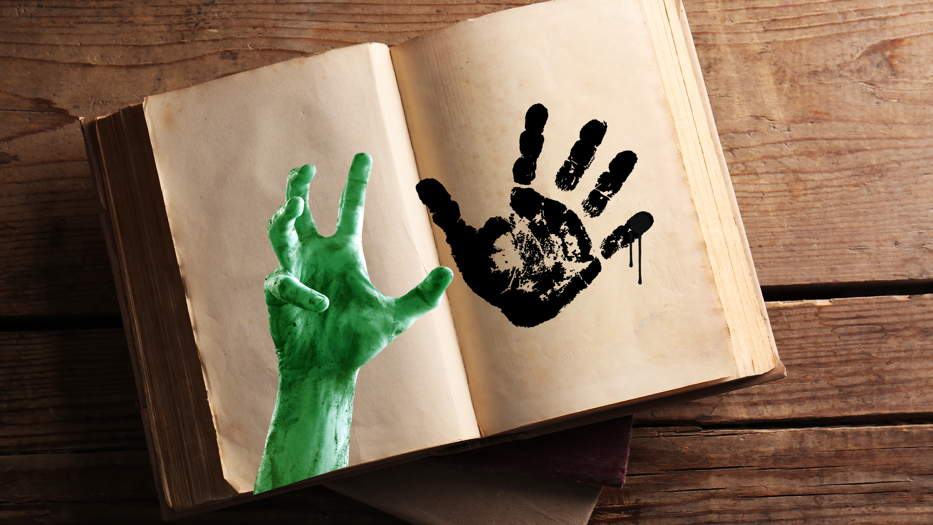 Book with spooky hand and handprint