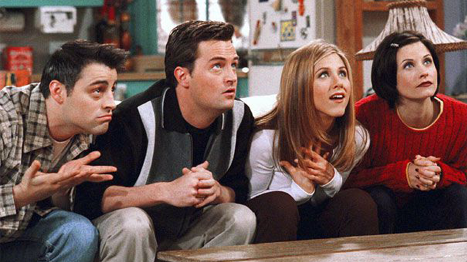 A scene from Friends featuring Joey, Chandler, Rachel and Monica 