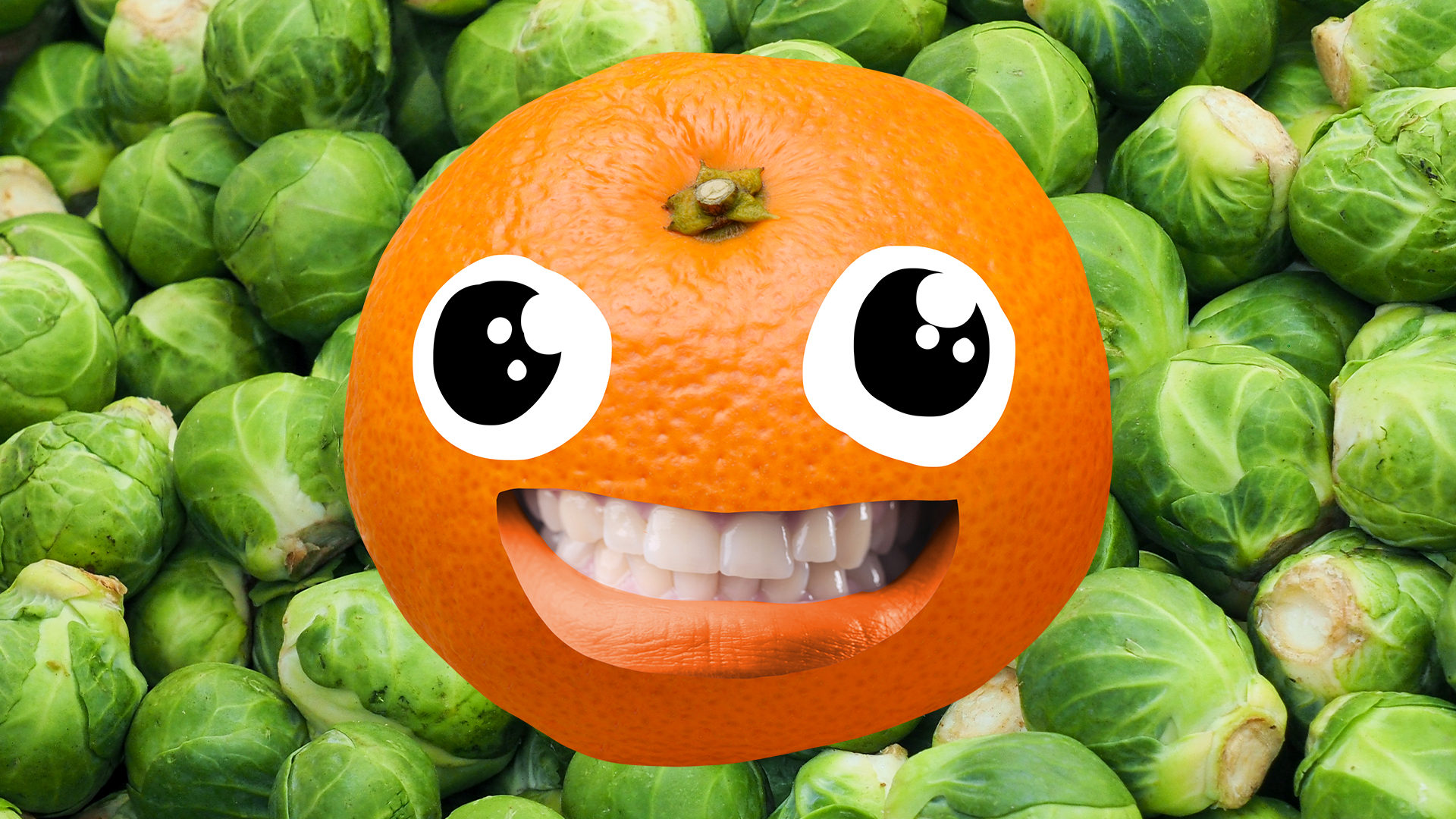 Grinning satsuma on Brussel sprout background