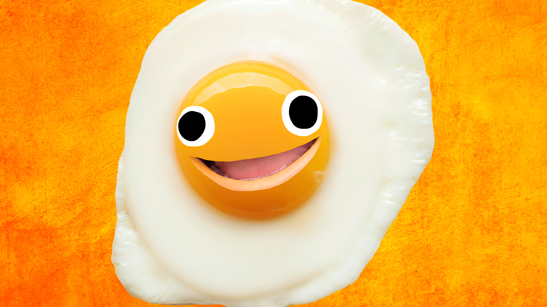 Smiley fried egg on orange background