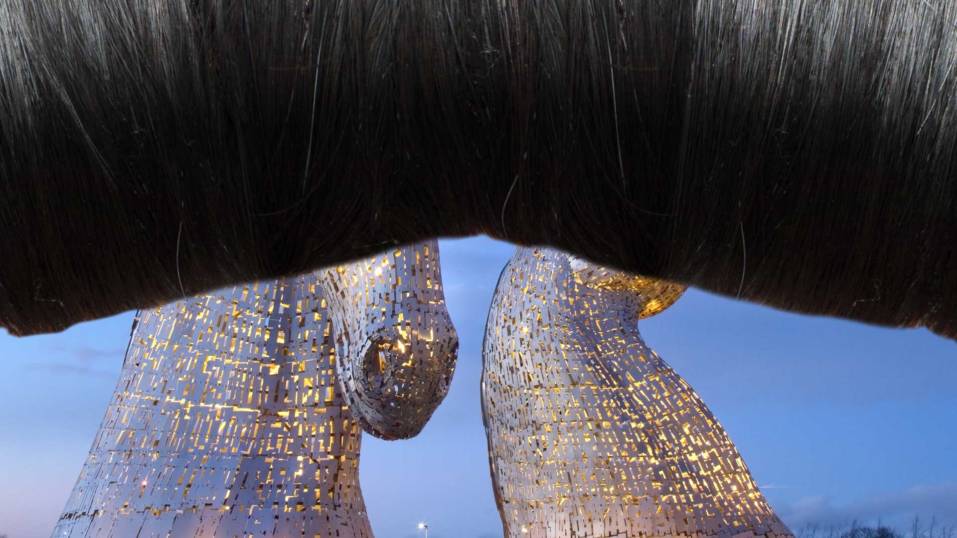 A long fringe obscuring a sculpture in Scotland