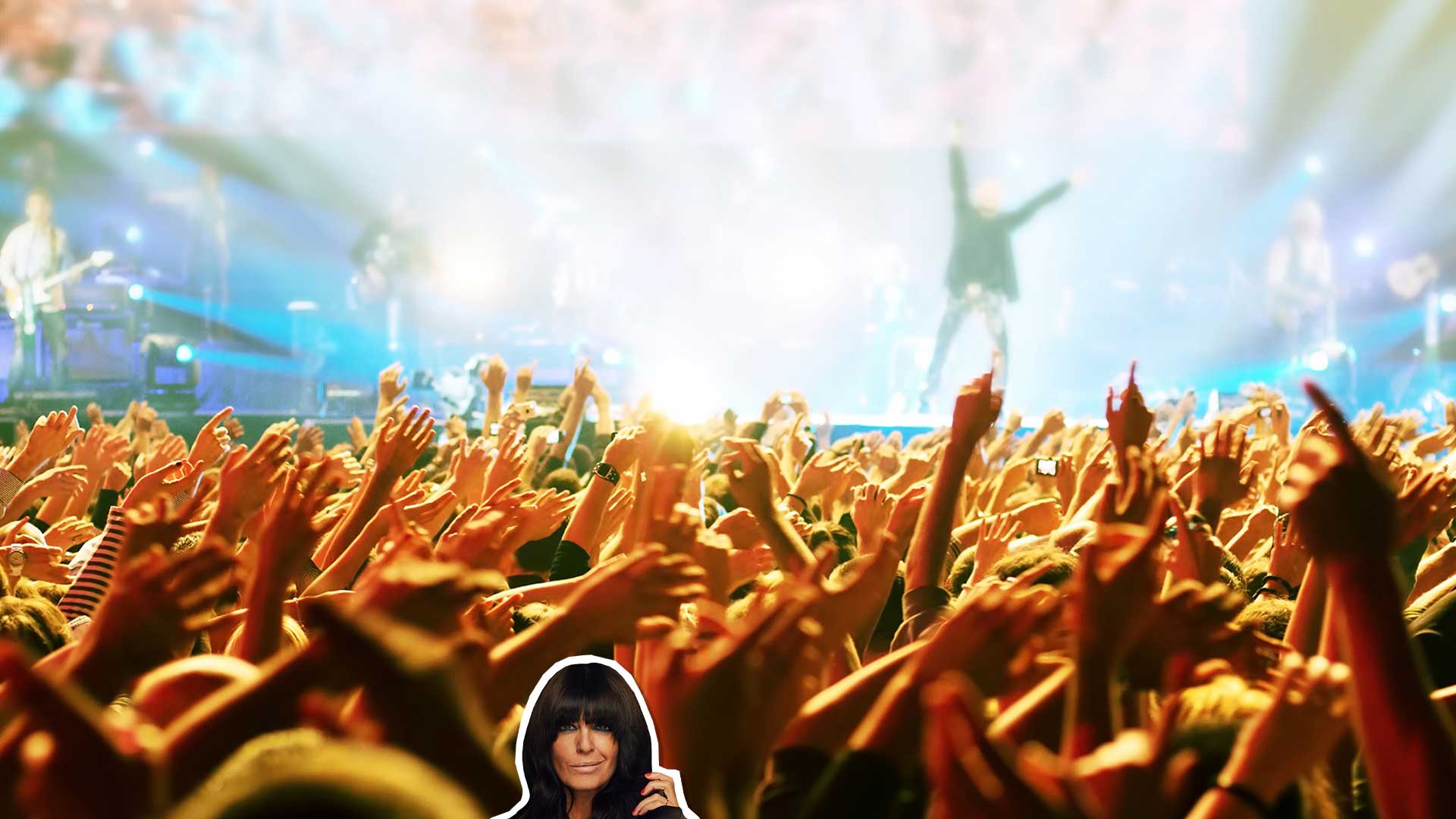 Claudia Winkleman in a large crowd watching a band play