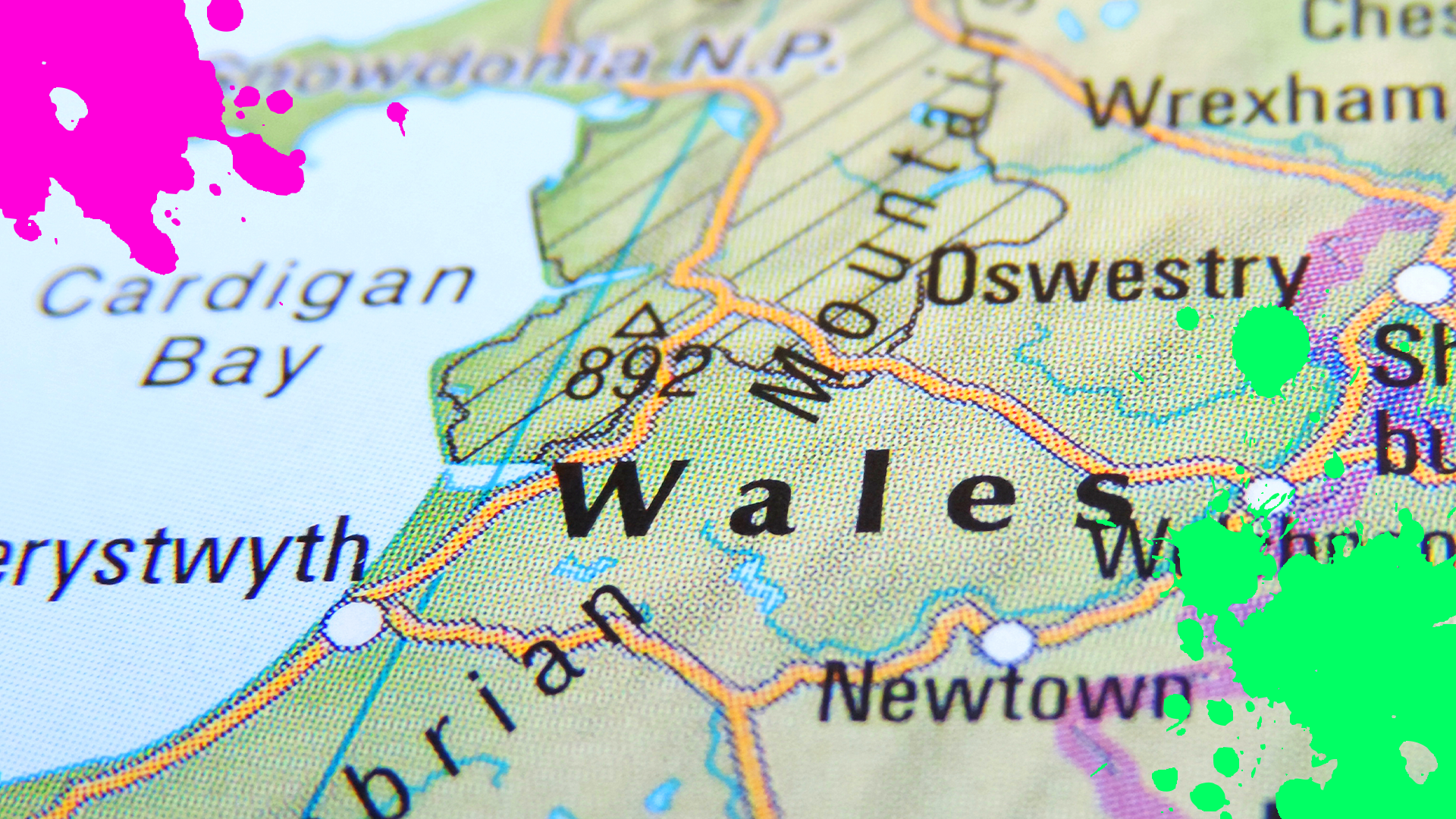 Map of Wales with colourful splats