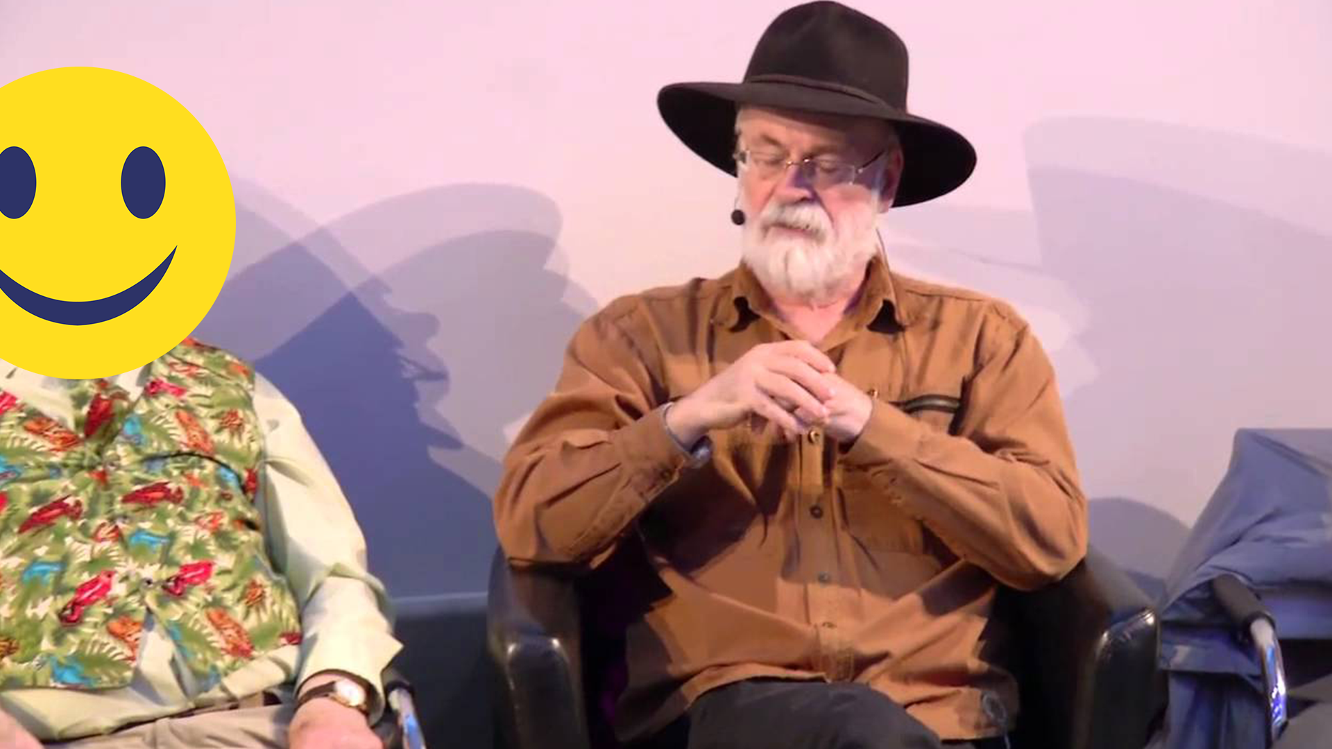 Terry Pratchett and a person disguised with an emoji