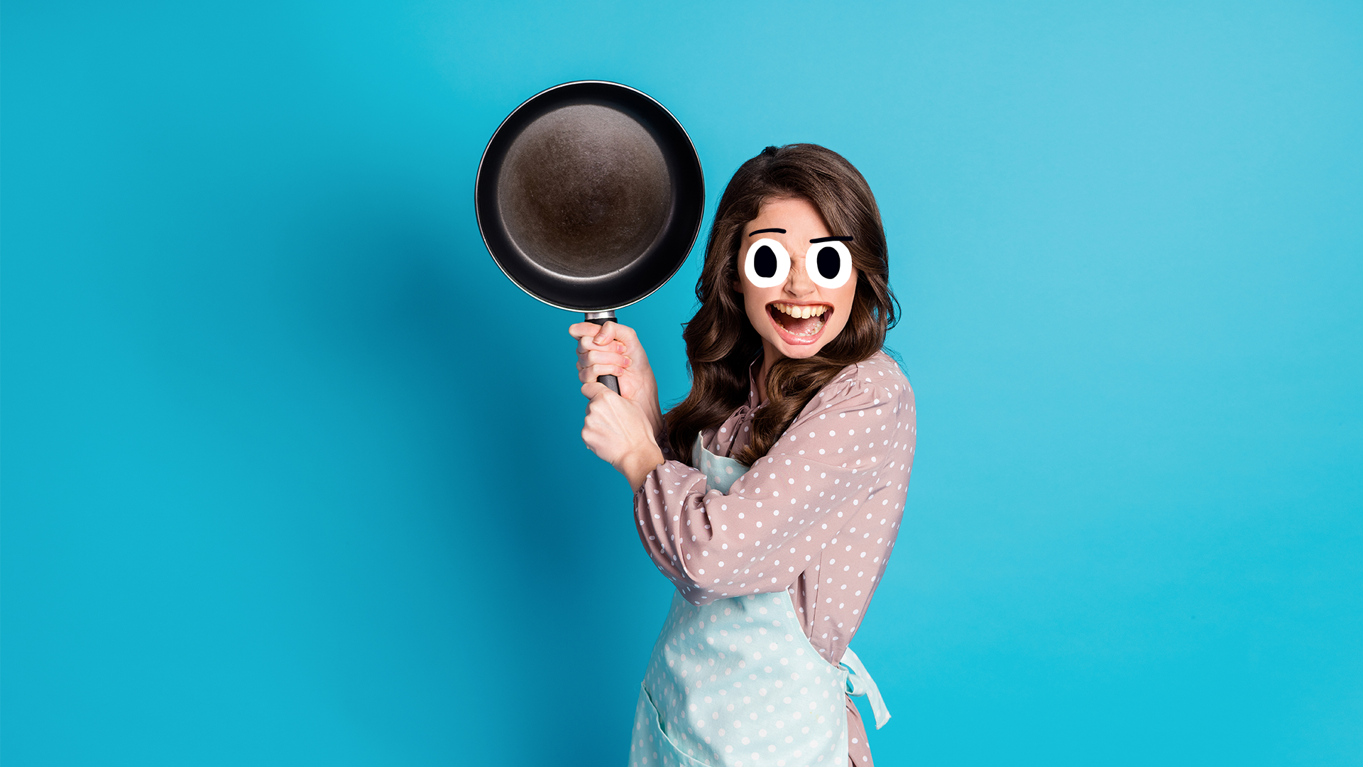 A woman holding a frying pan