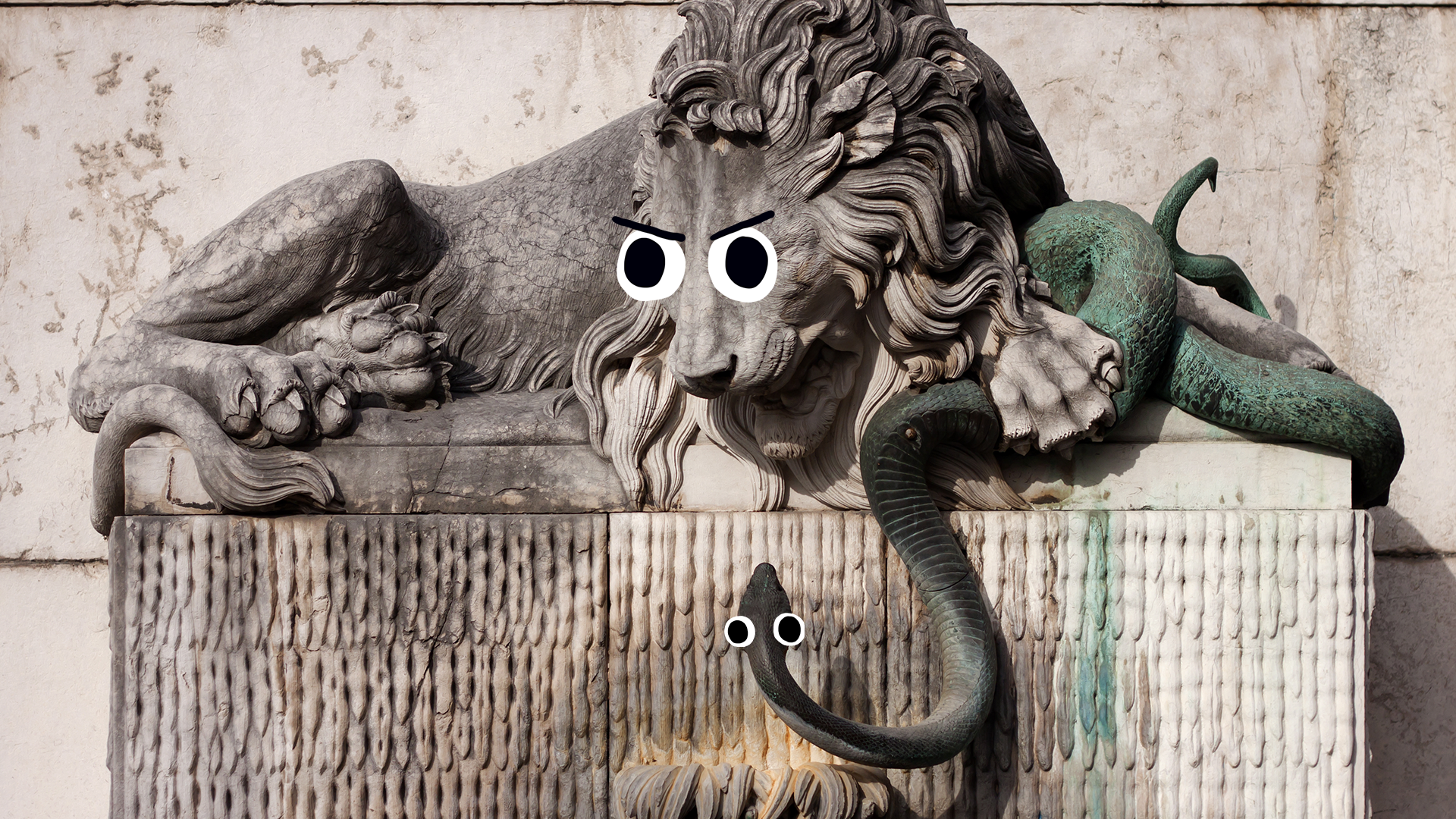 A statue of a lion and a snake