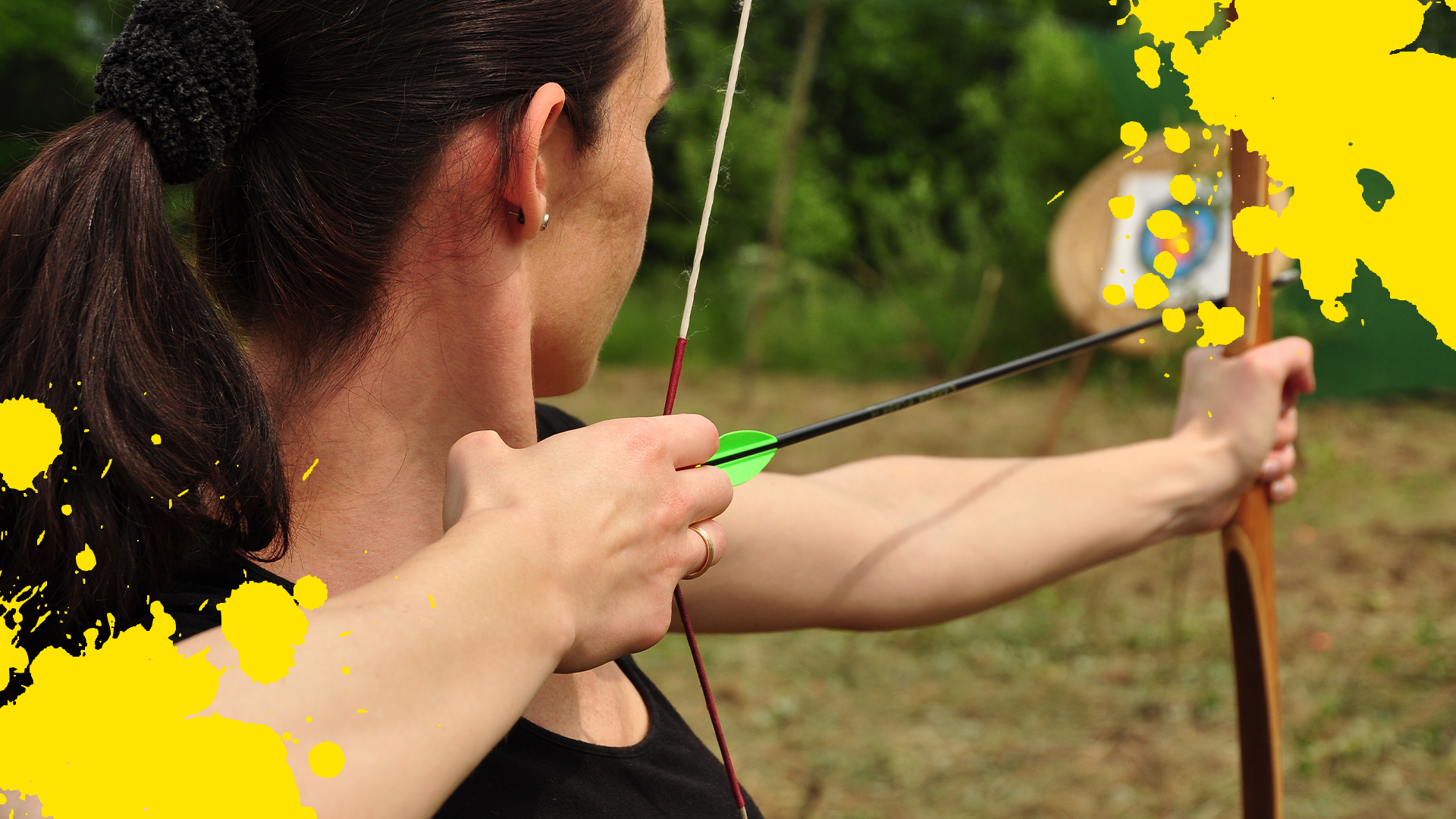 Woman firing arrow and yellow splats