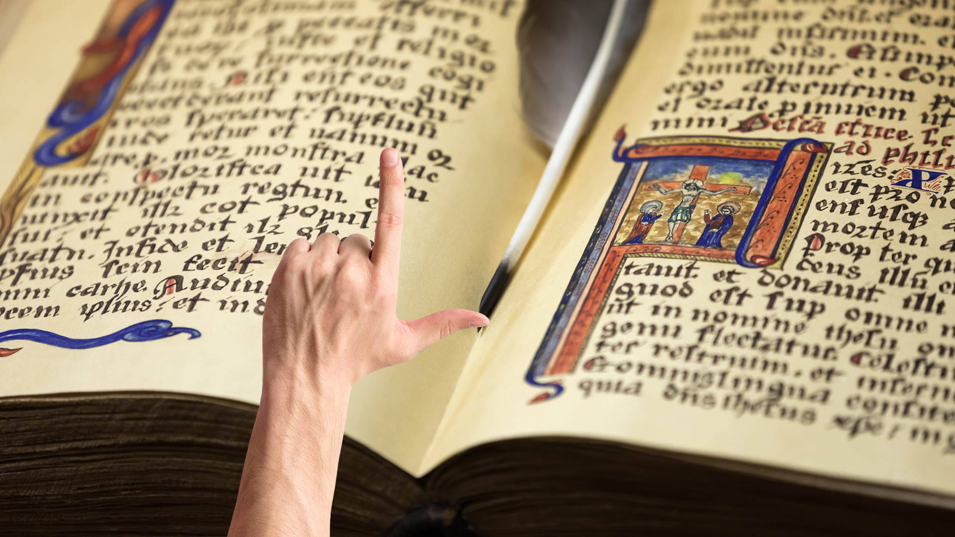 Hand pointing at old manuscript