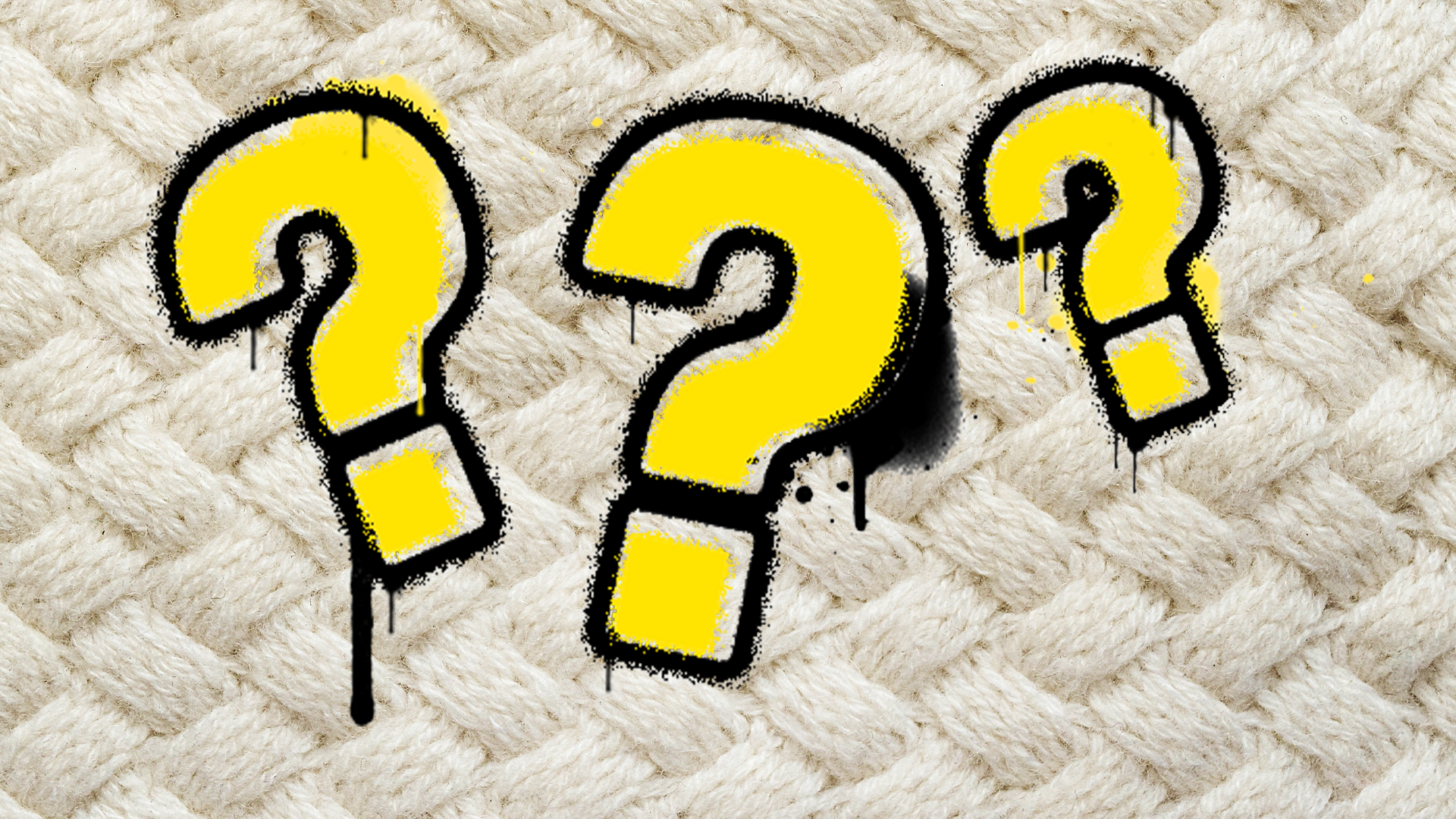 Question marks on knitted background