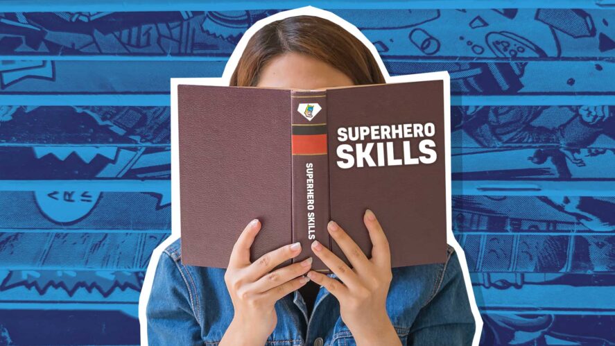 A woman reading a book about superhero skills