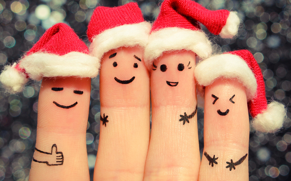 A group of fingers wearing Santa hats