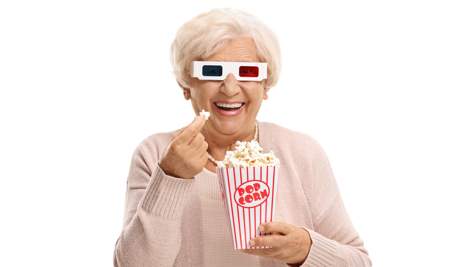 A grandma eating popcorn in 3D glasses