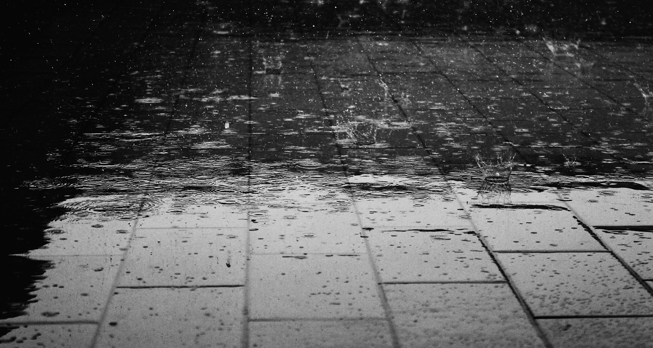 Rain bounces of a wet pavement