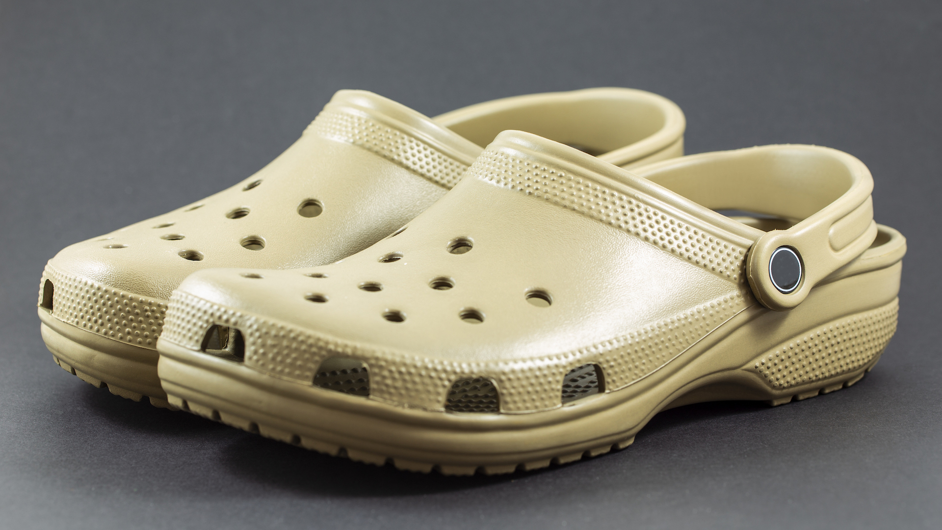 A pair of beige Crocs