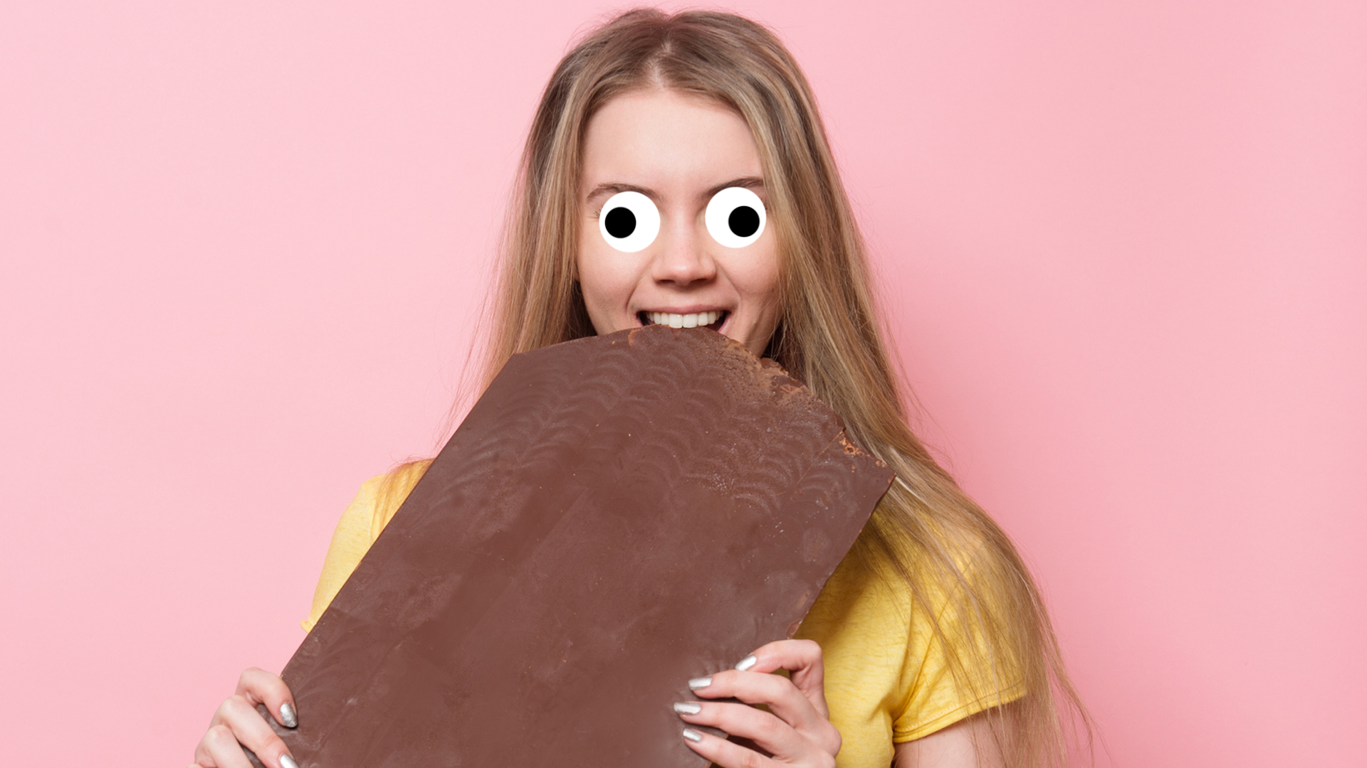 A woman eating a big bar of chocolate 