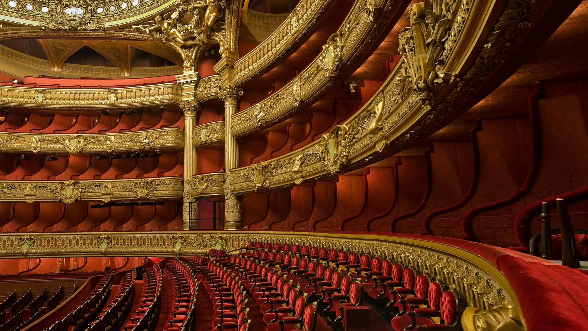 Theatre auditorium with red velvet seats