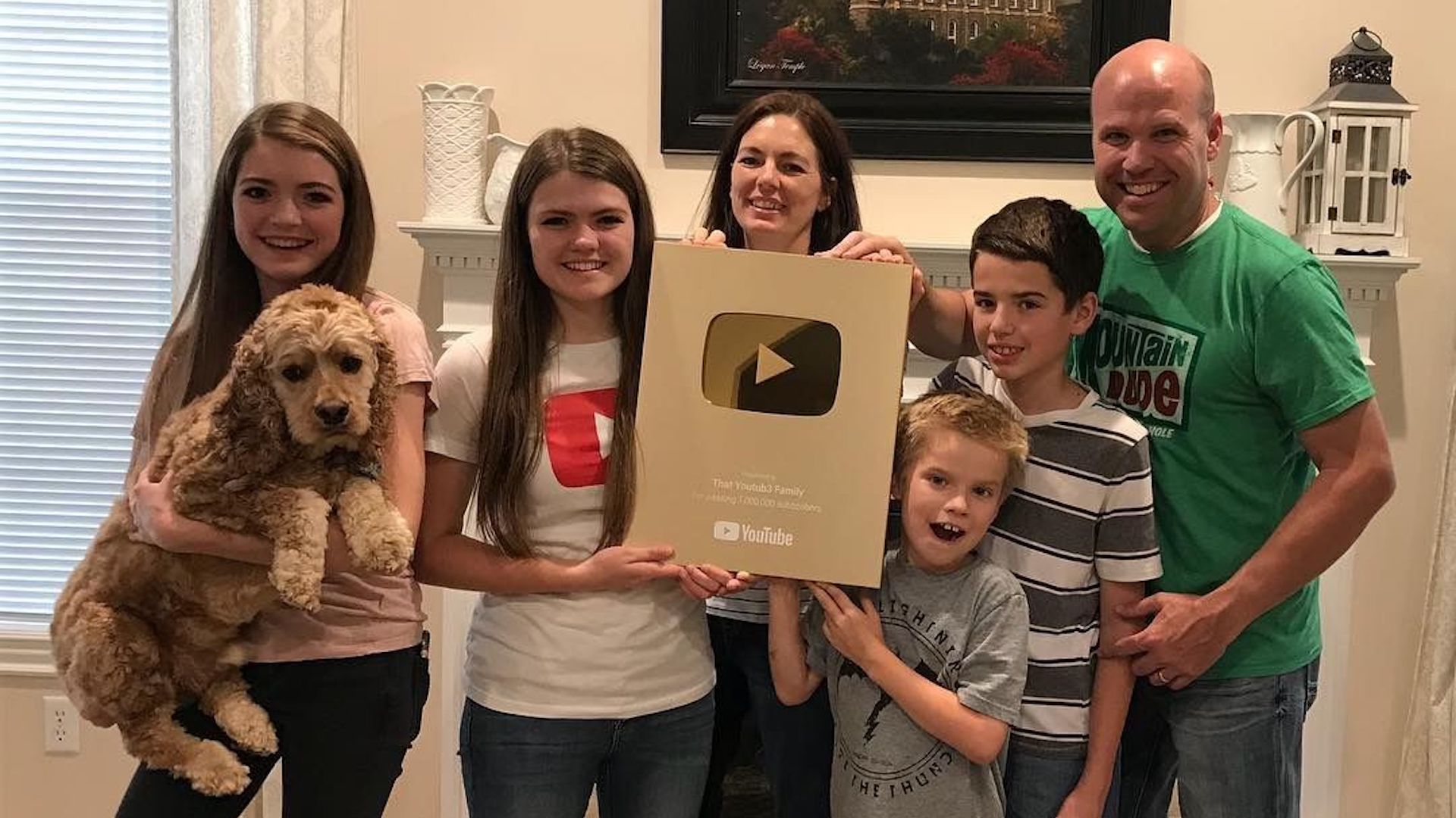 That YouTub3 Family pose with a celebratory plaque from YouTube