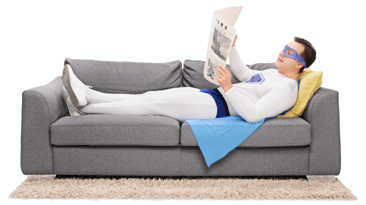 A superhero relaxing on a sofa