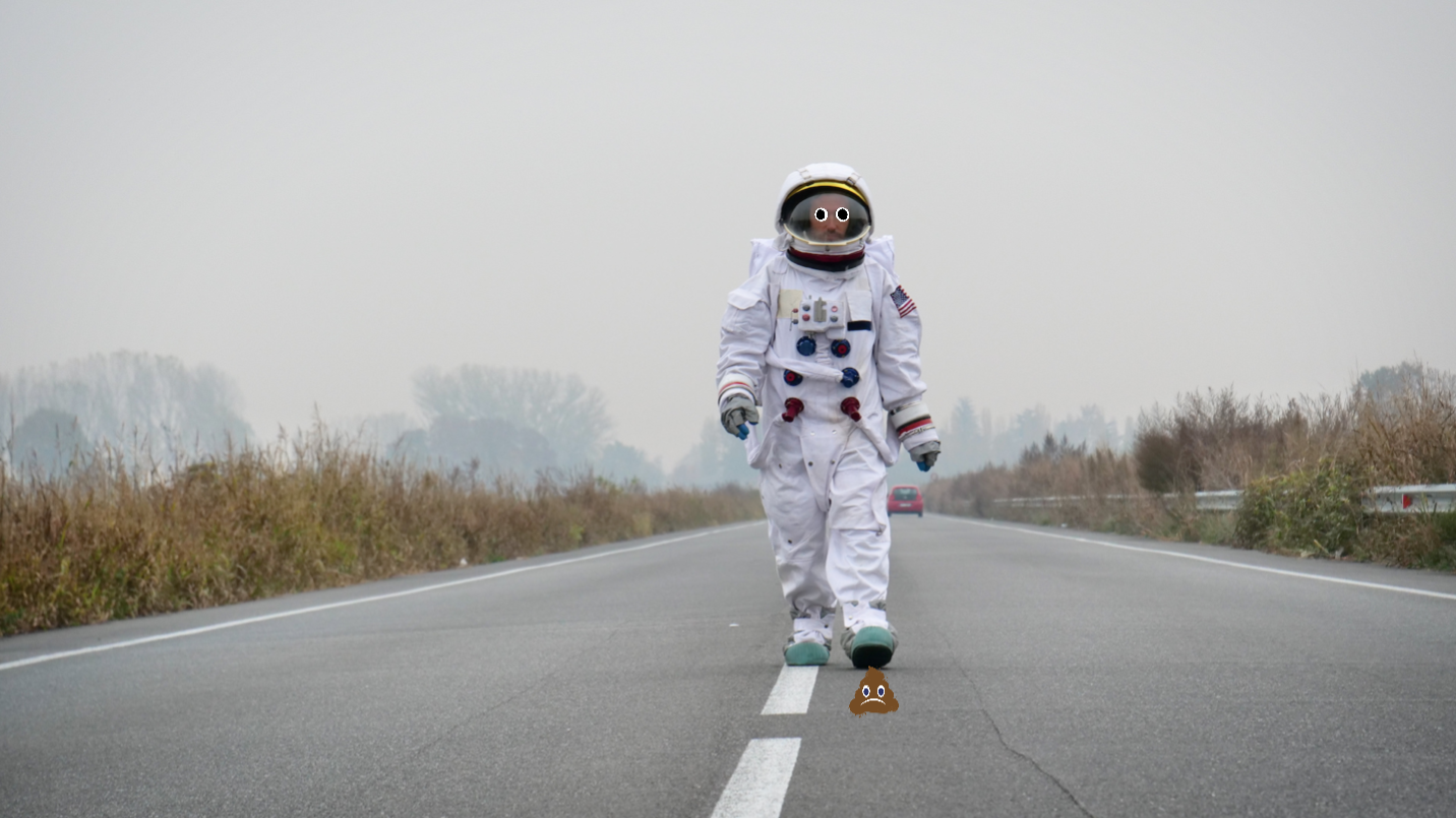An astronaut walking along a motorway