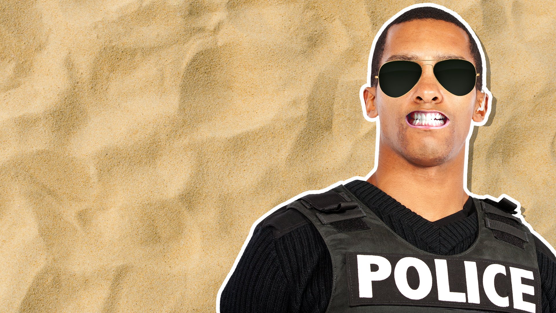 A police officer next to a sandy background