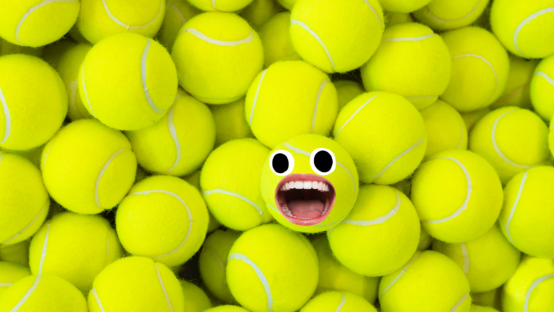 Pile of tennis balls with ball with face