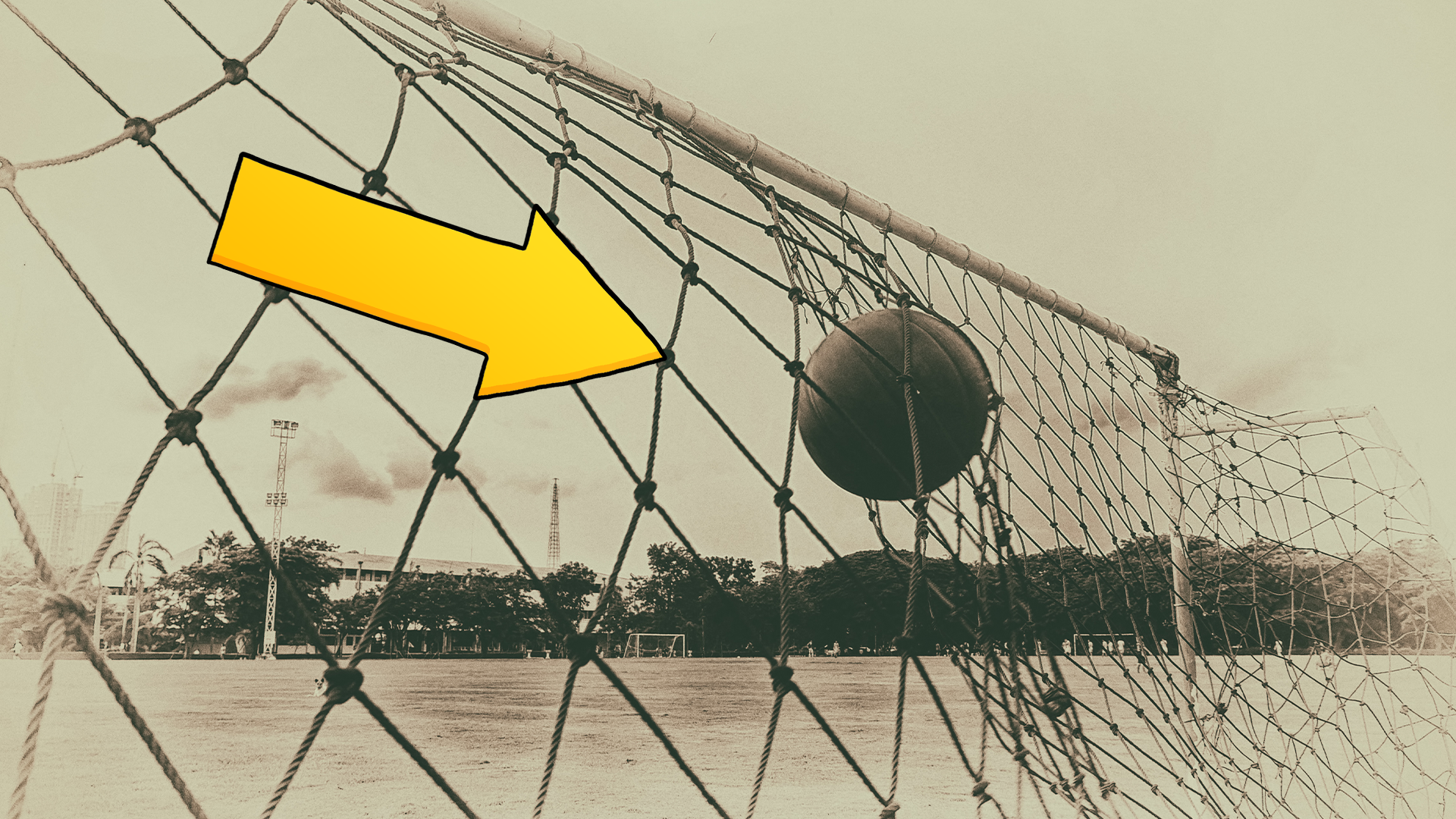 Old photo of football and net with arrow 