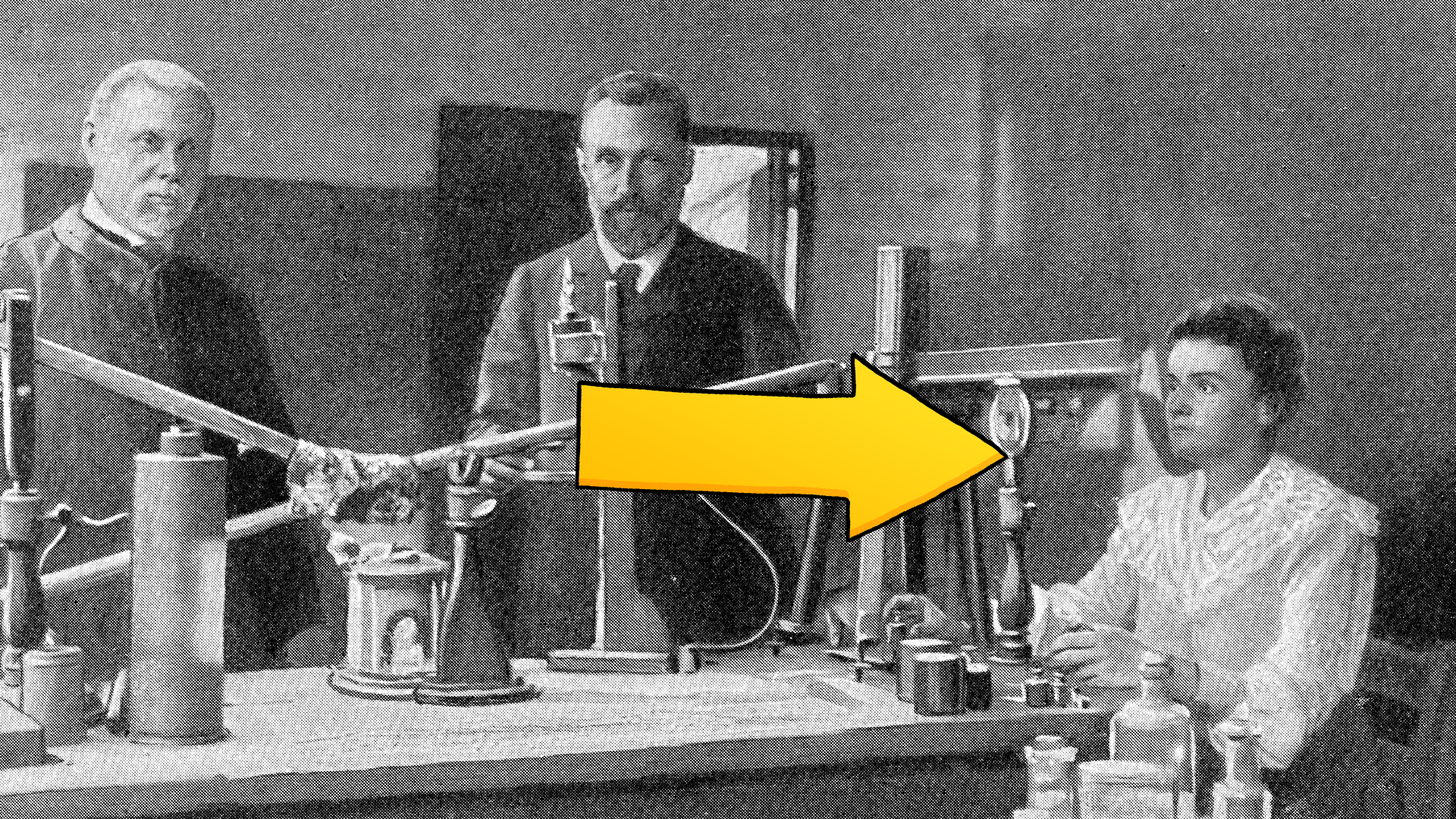 Old picture of three people, with yellow arrow pointing to Marie Curie 