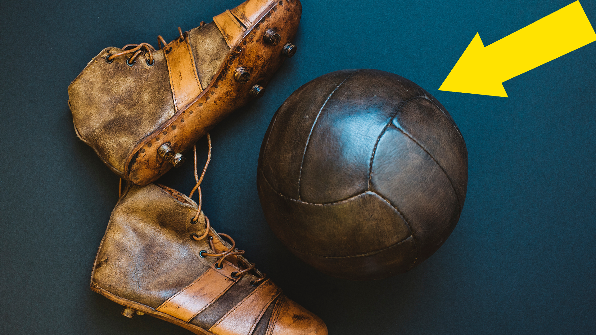 Old fashioned football and football boots