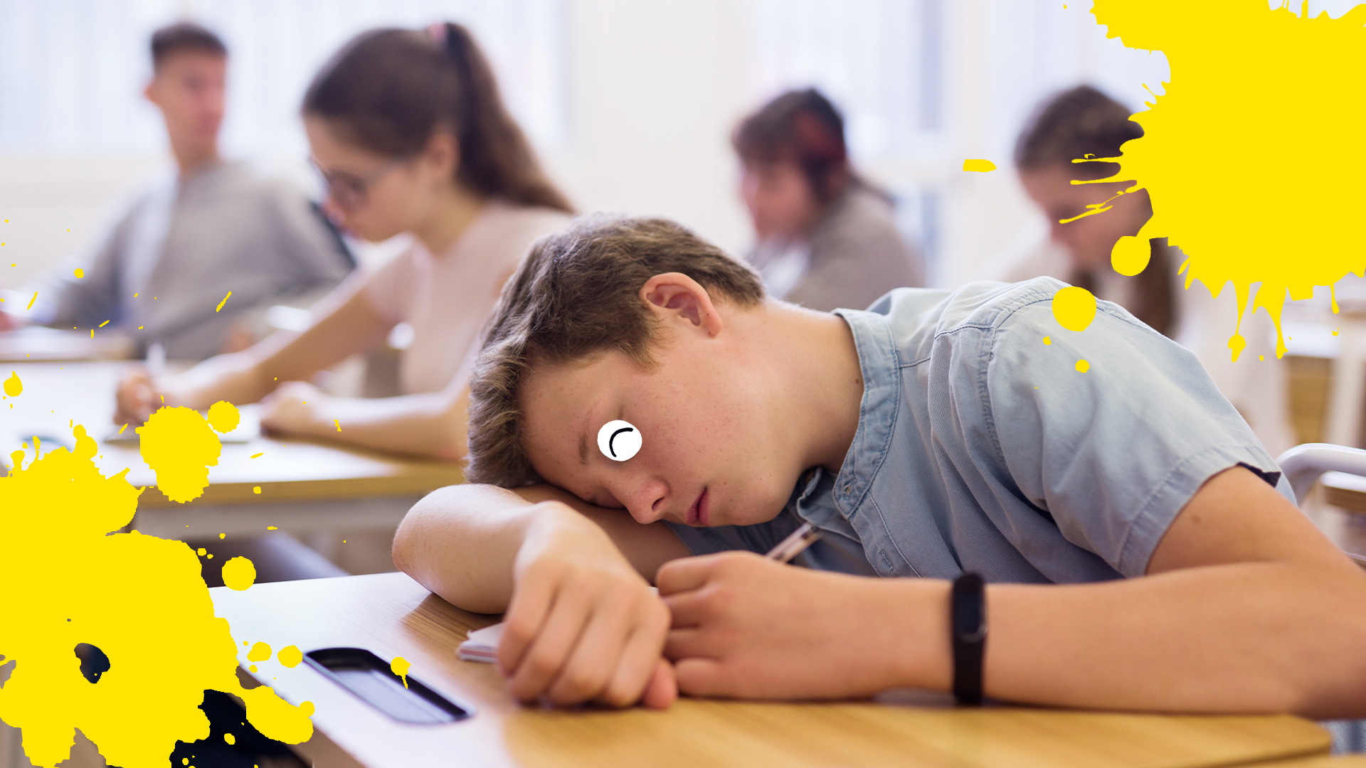 Boy sleeping in class with yellow splats