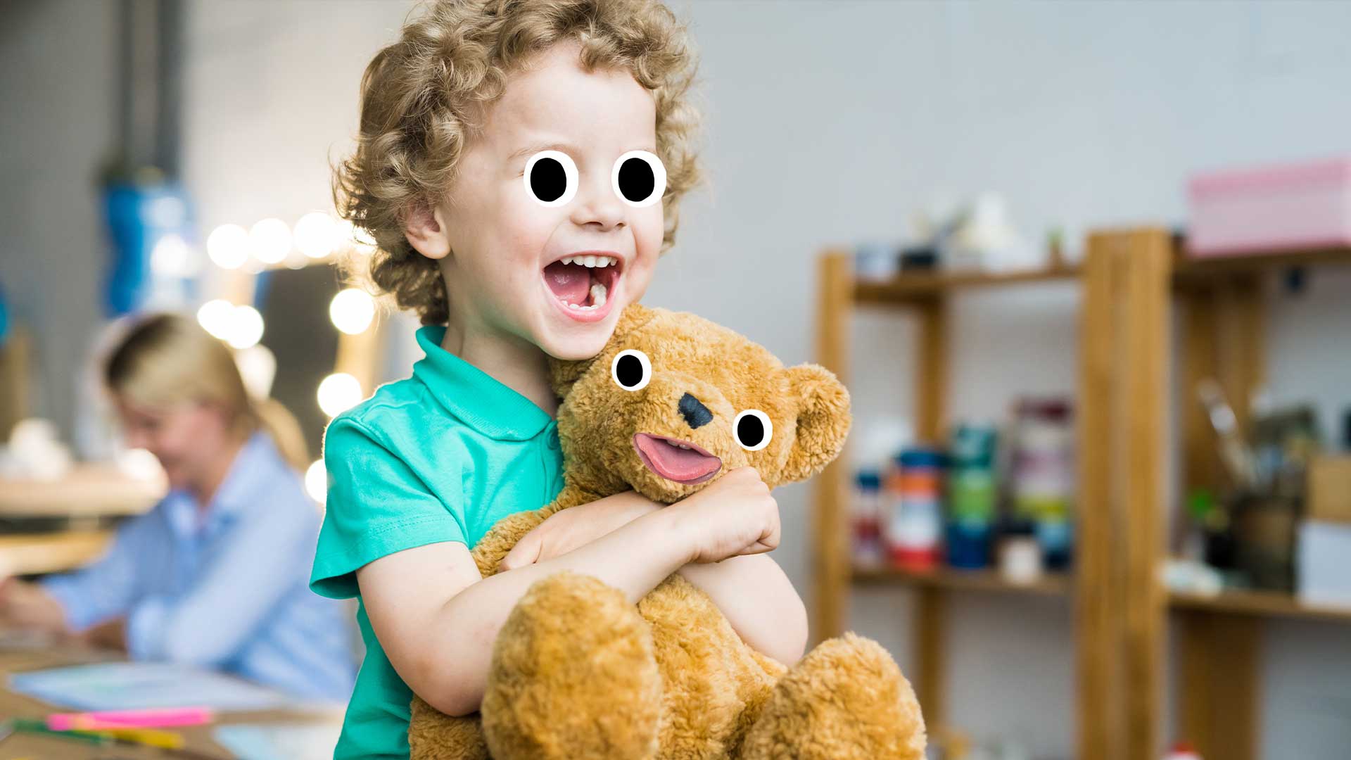 A boy holding a teddy bear