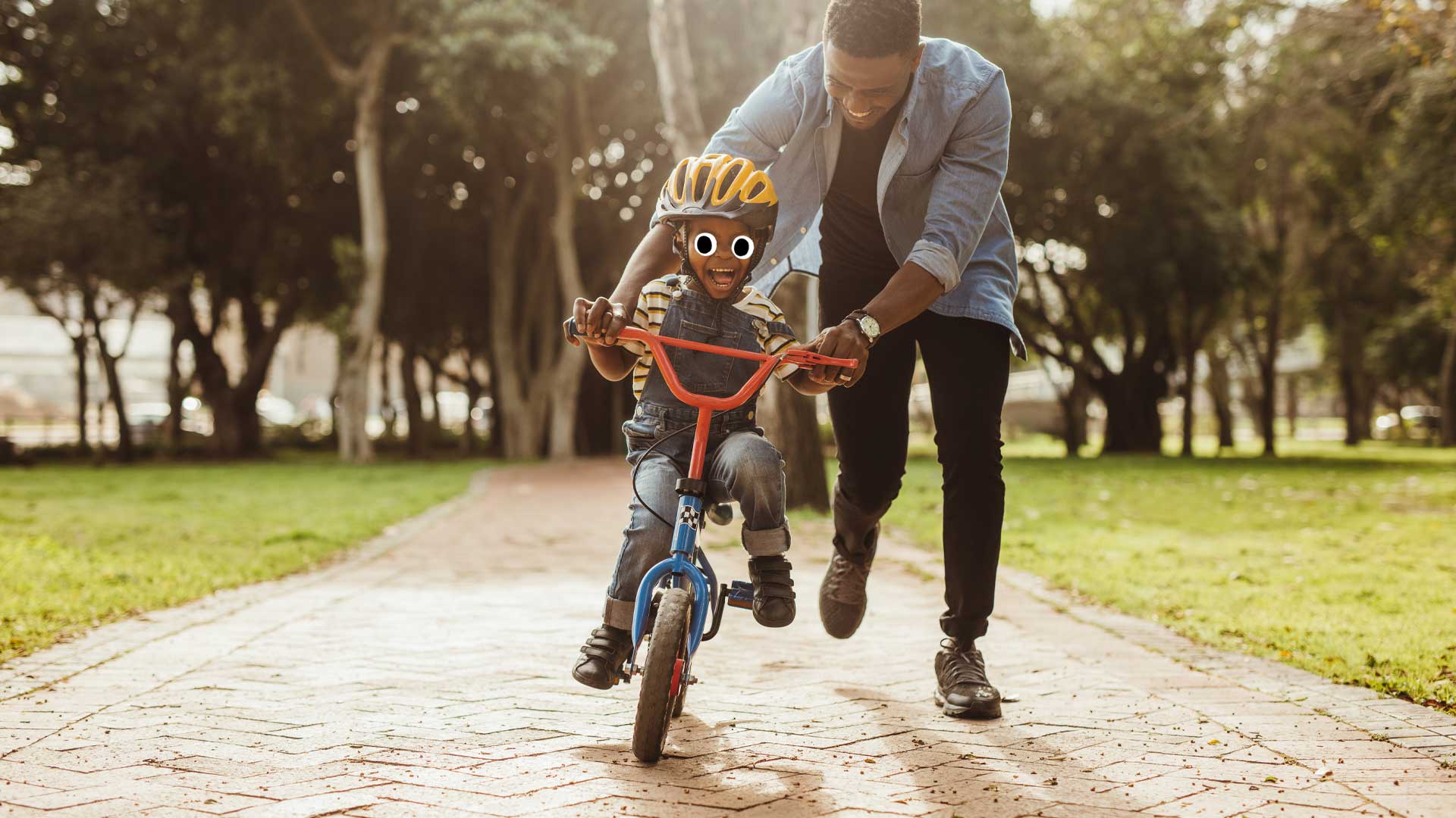 A father and son having fun on a bike