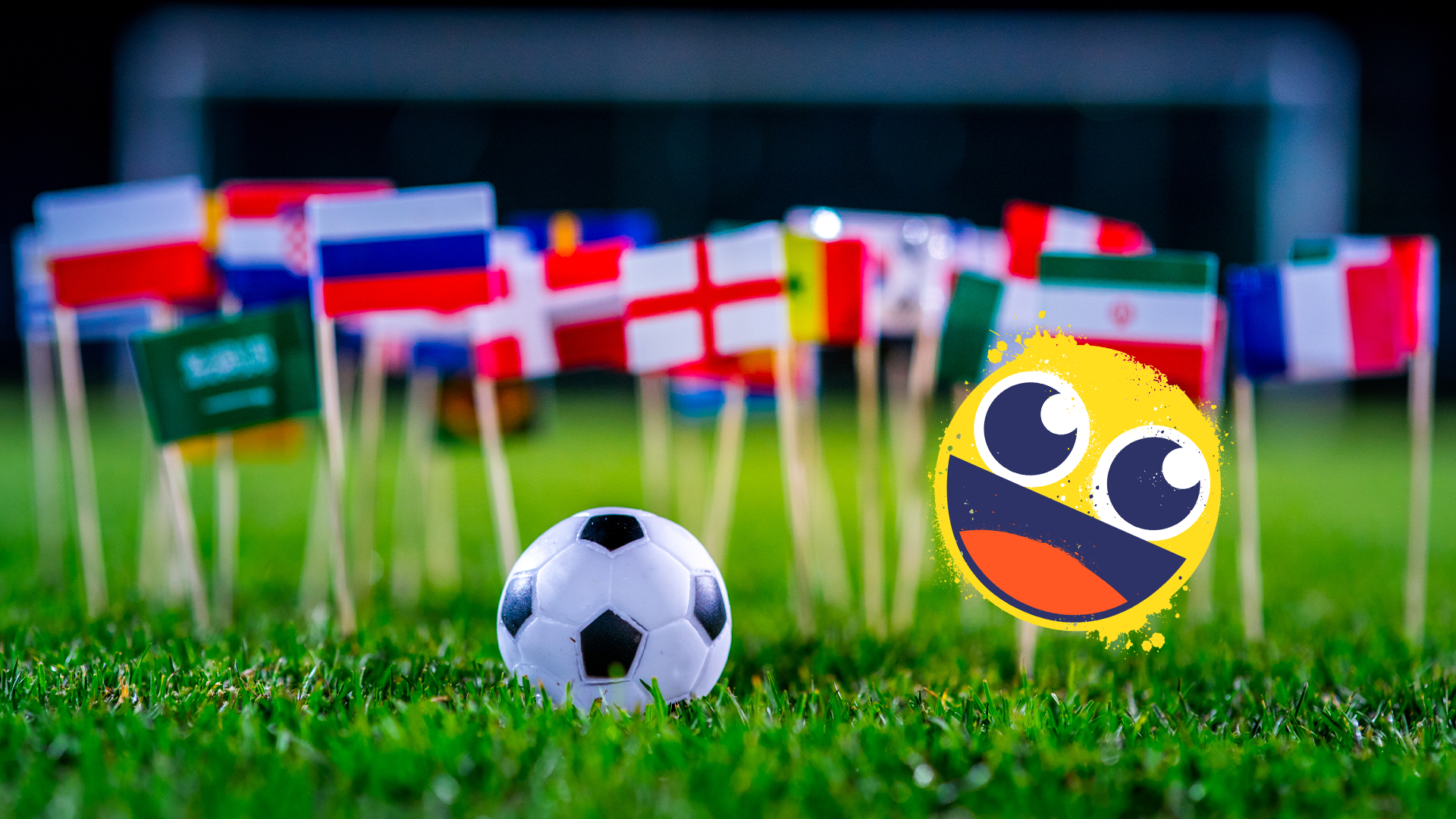 World flags in grass, football and smiley emoji 
