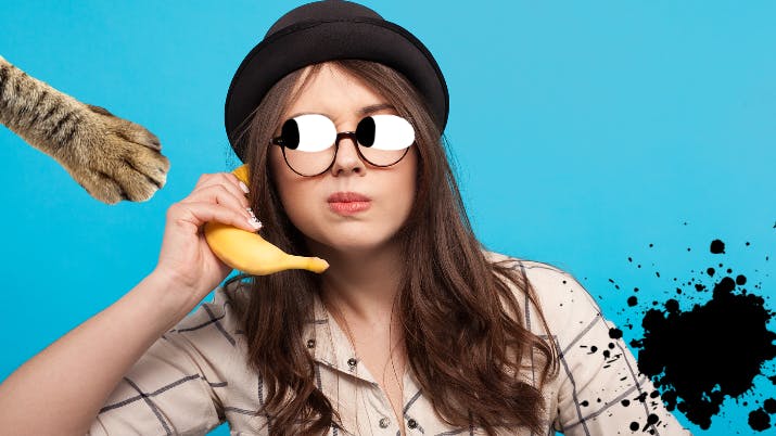 A woman using a banana as a telephone