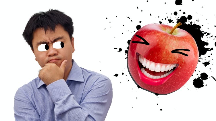 A man and a smiling apple