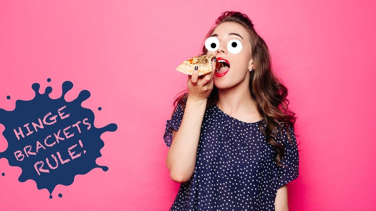 A woman eating a slice of pizza