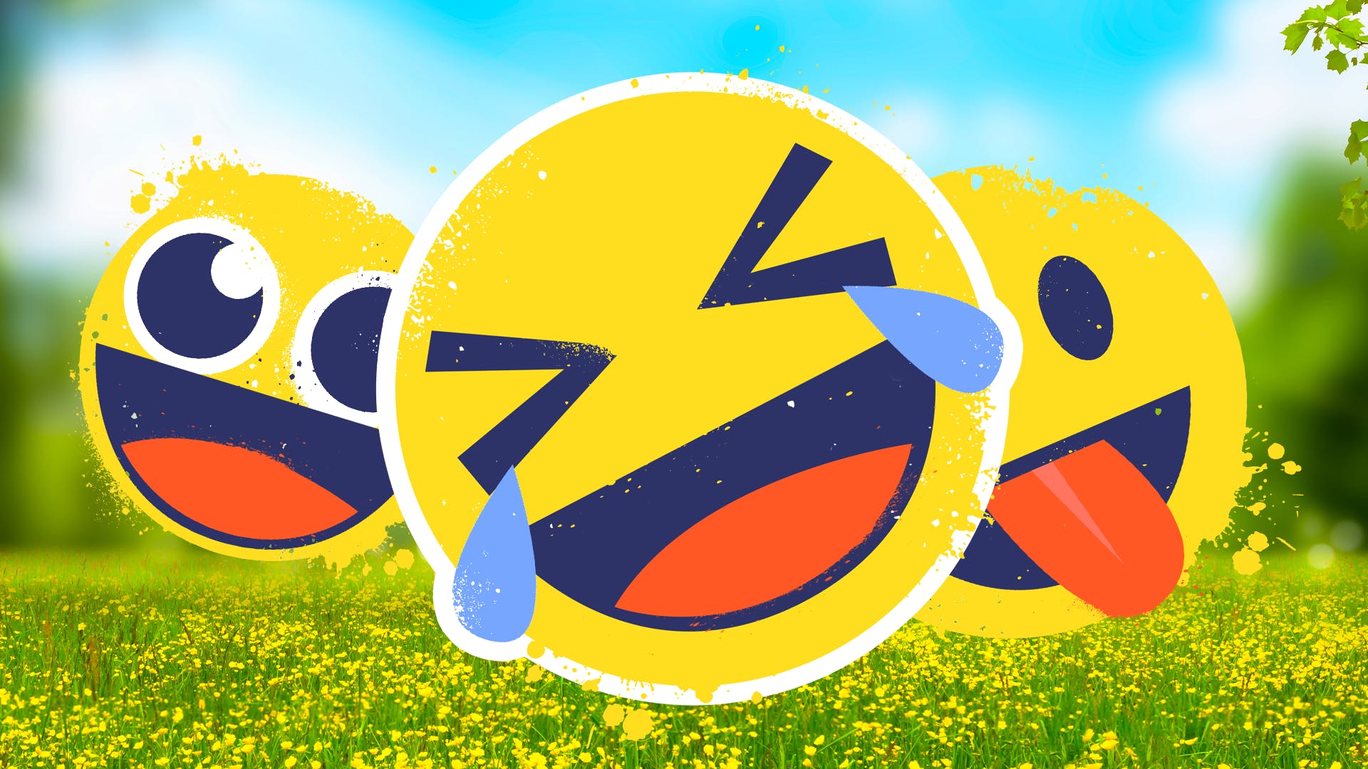 Emojis laughing in a grassy field