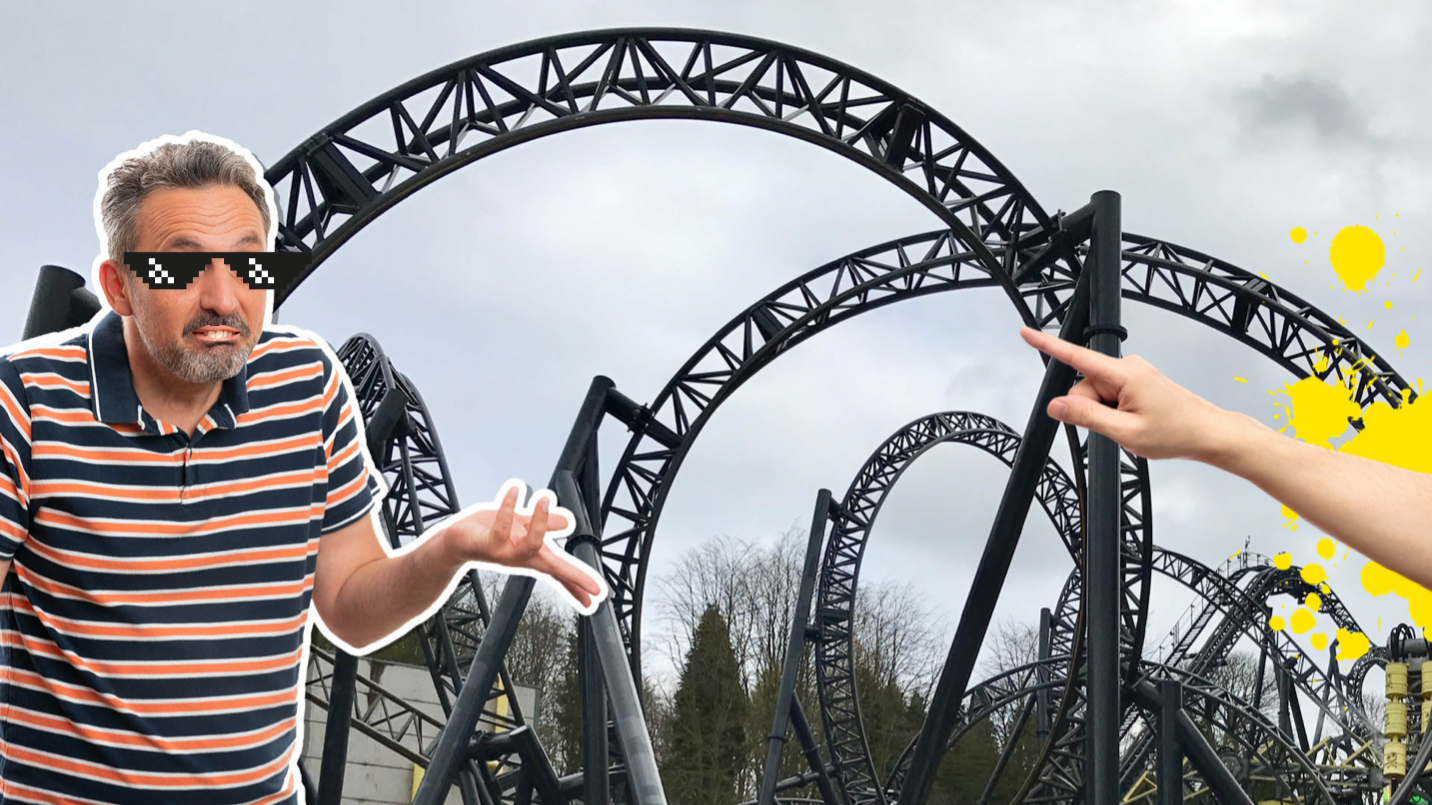 Man shrugging next to a rollercoaster
