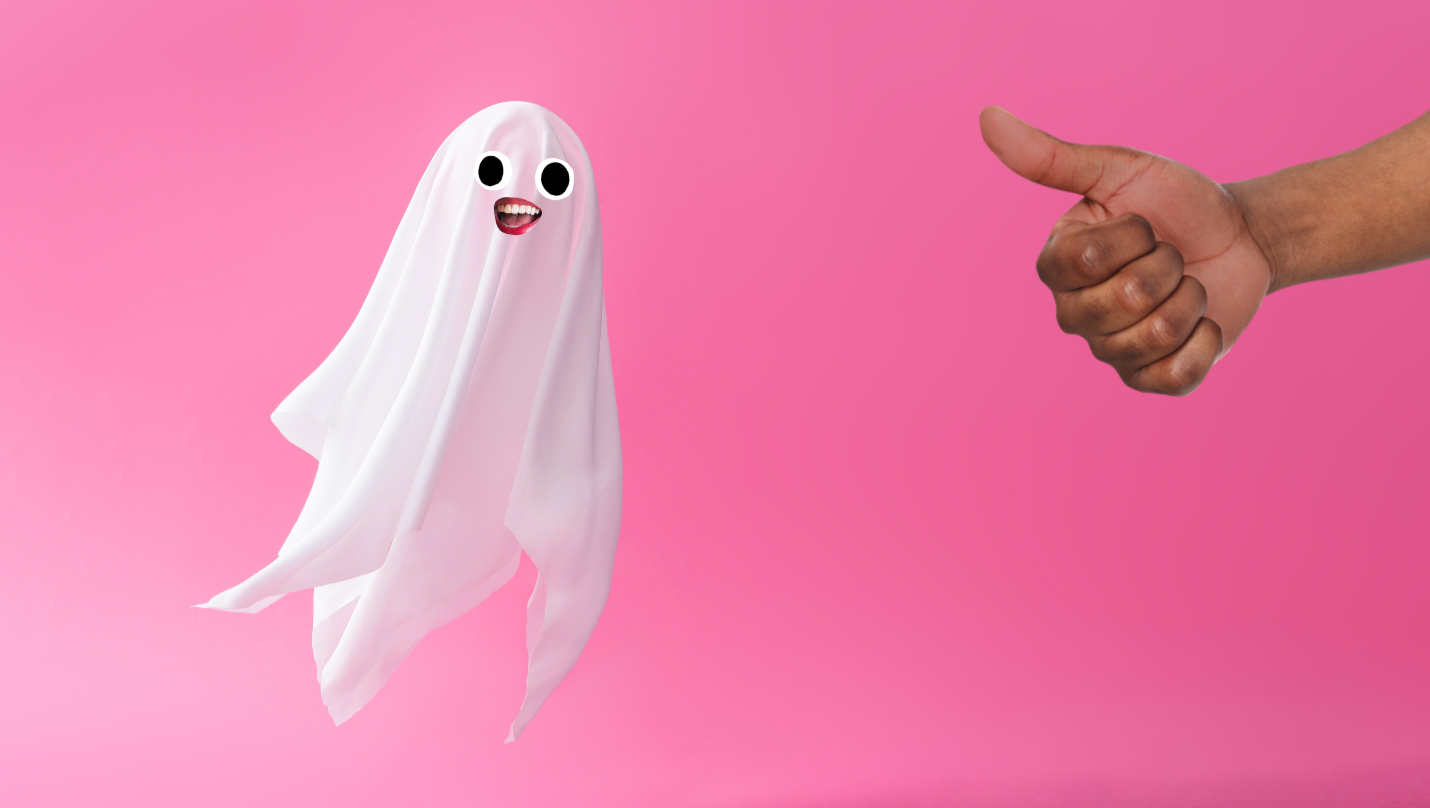 A ghost floating against a pink background