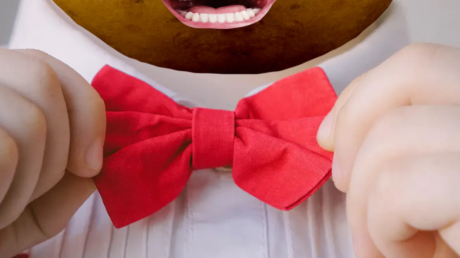 A potato putting on a snazzy bowtie